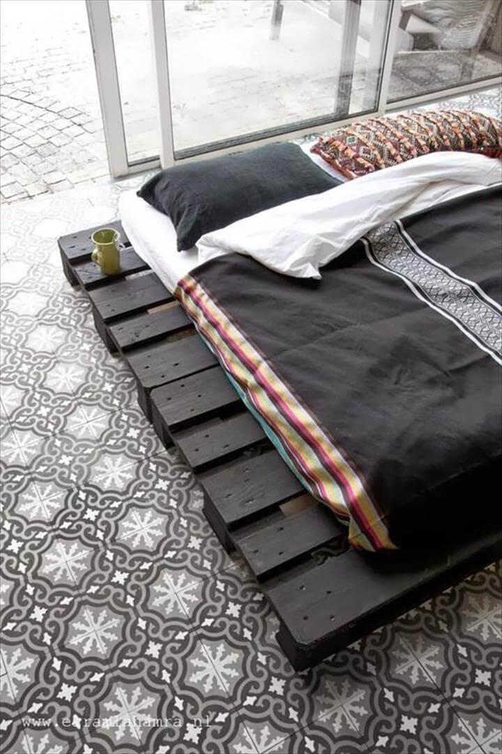 upcycled black stained pallet platform bed
