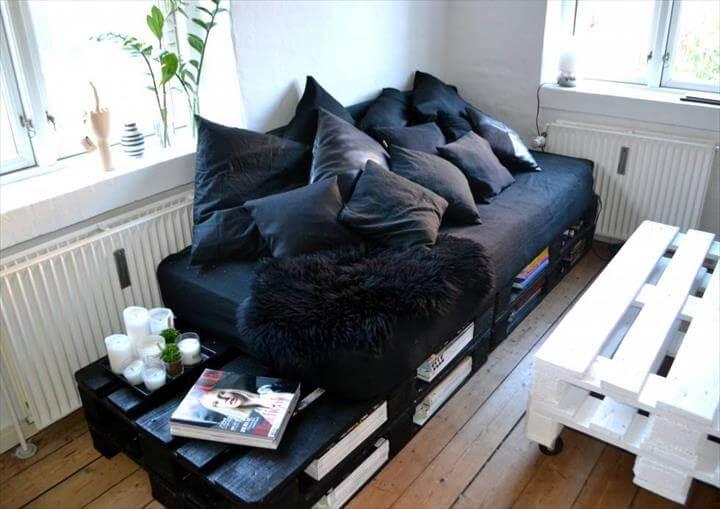 black stained pallet sofa with book storage