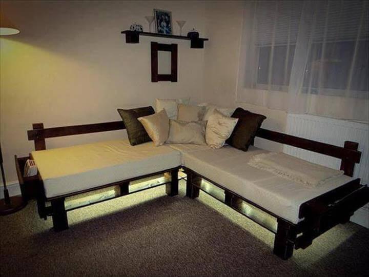 pallet sofa with lights and white cushion