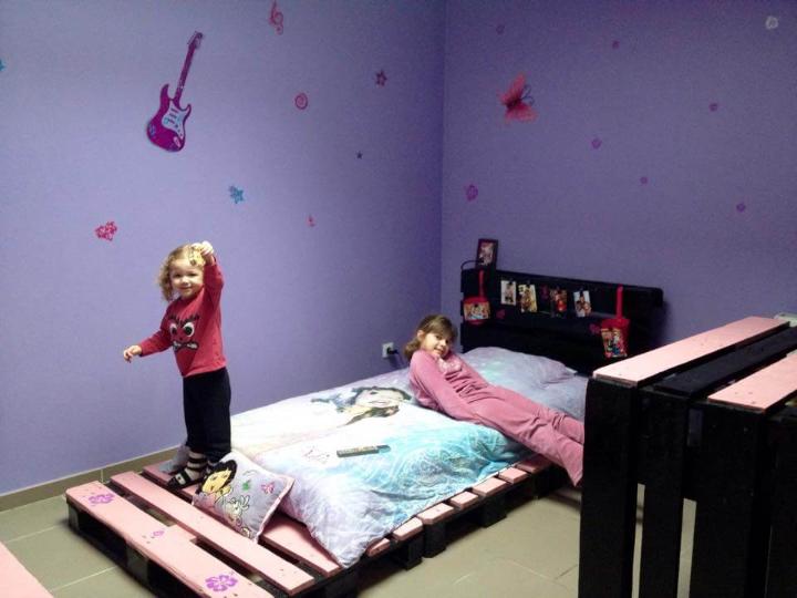 recycled pallet pink and black toddler bed with headboard