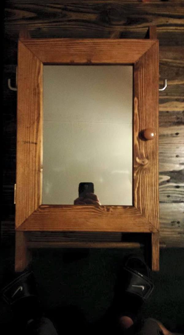 upcycled pallet wall cabinet with mirror and towel rack