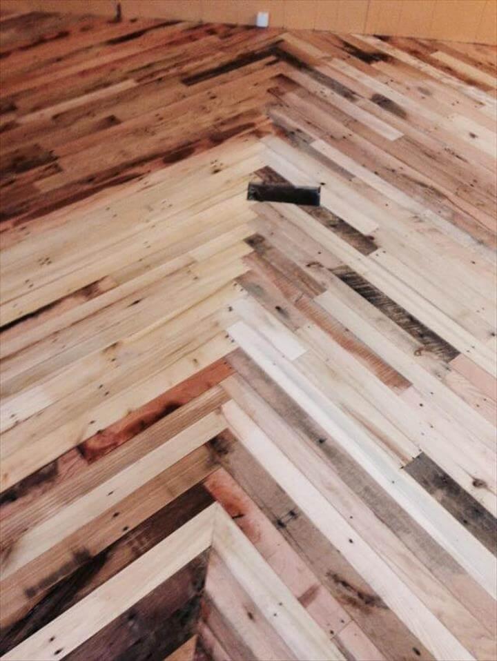 diy pallet wood interior flooring in chevron style