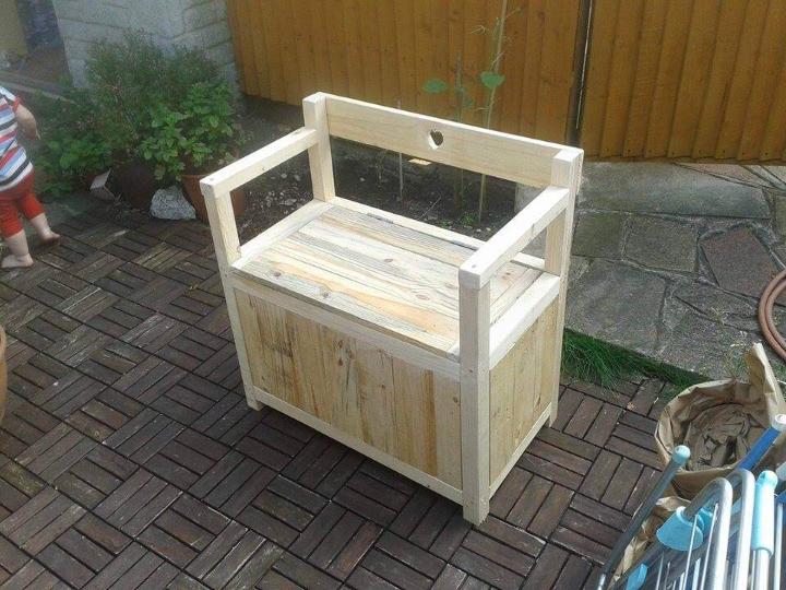 sturdy wooden pallet chair with inside storage space