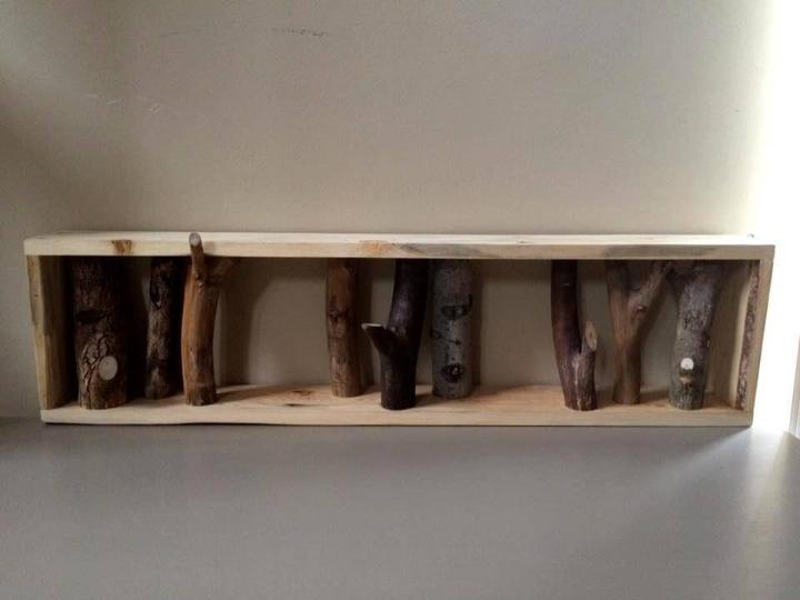 Recycled pallet and tree branch coat rack