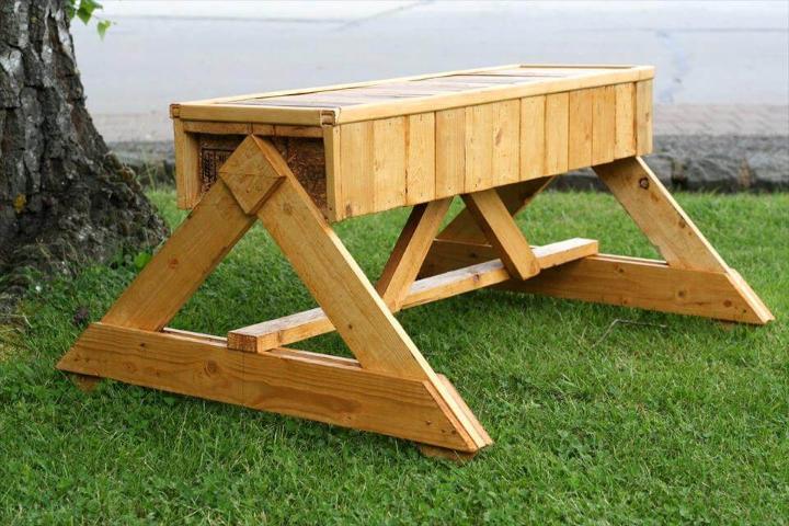 handcrafted pallet bench with triangular wooden legs