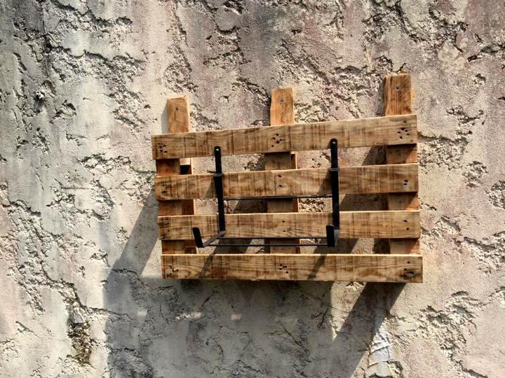 low-cost wooden pallet and metal wall hanging planter holder