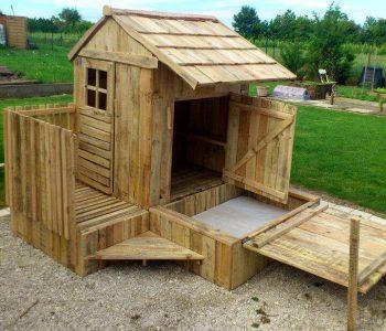 budget-friendly pallet playhouse with installed sandbox