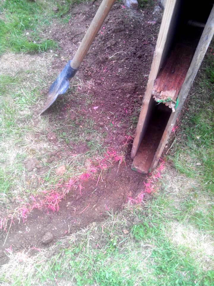 digging the ground for pallet pool fencing