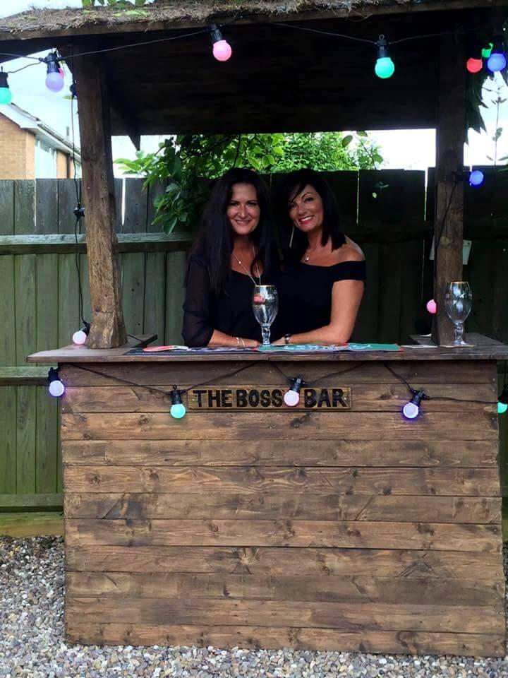 upcycled wooden pallet outdoor bar with light bulbs