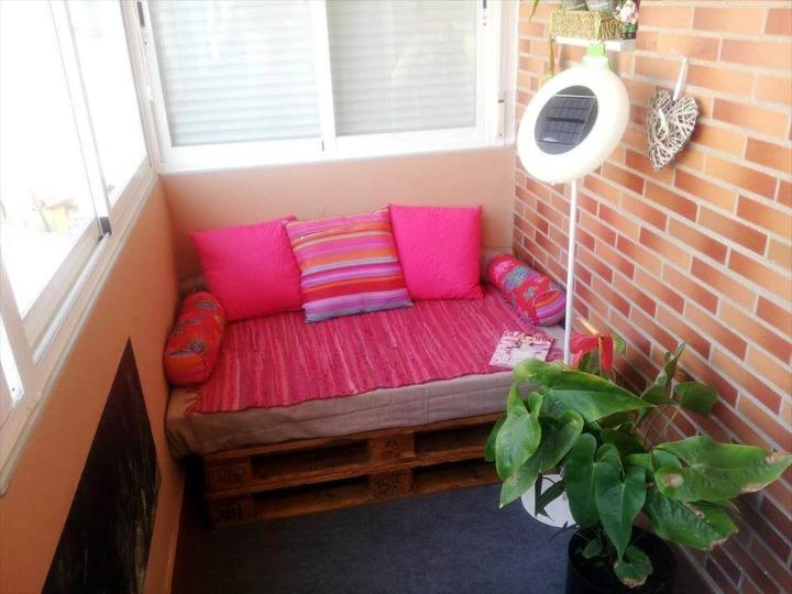 red cushioned stacked pallet seat or daybed