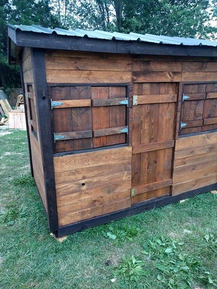 robust wooden pallet playhouse with chevron roof