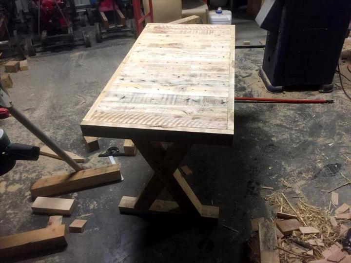 upcycled wooden pallet table with criss cross legs