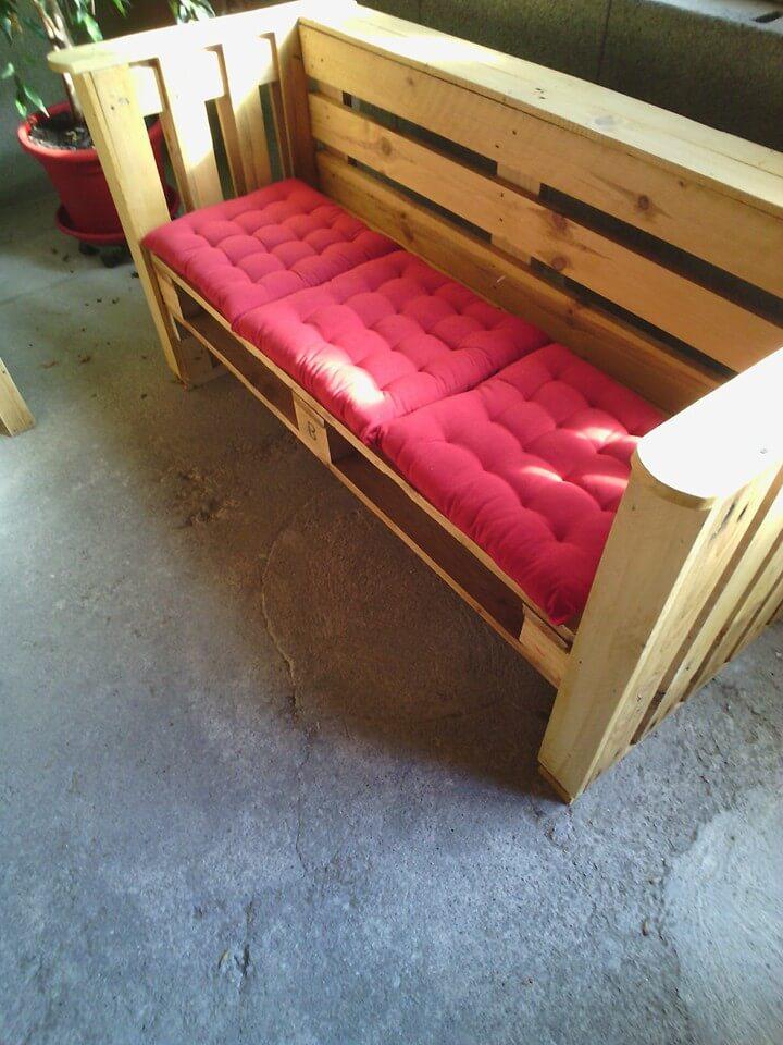 repurposed pallet bench with pink cushion