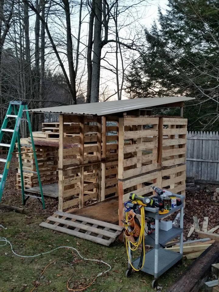 beautiful wooden pallet bike shed with metal roof