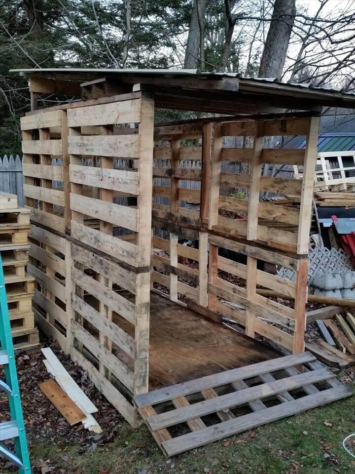 upcycled pallet bike shed with metal roof