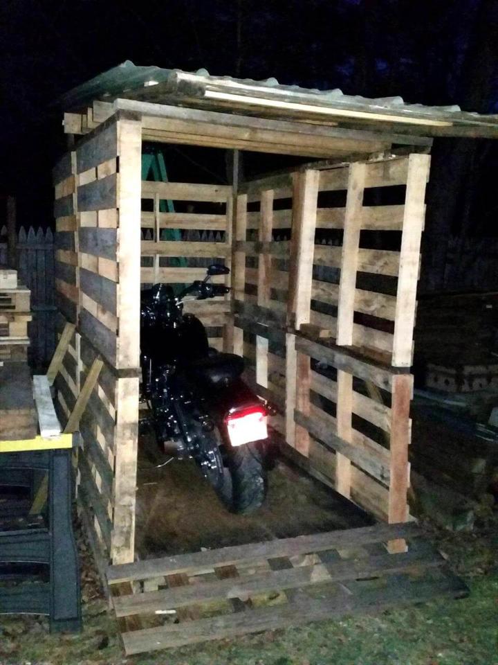 repurposed pallet bike shed with metal titled roof