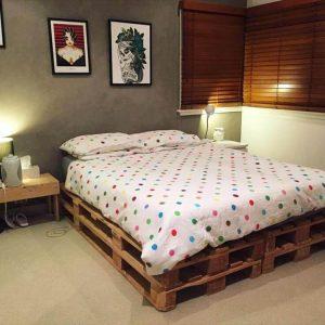 stacked pallet bed with white mattress