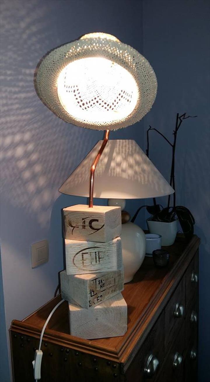 recycled old pallet wood remains and old hat table lamp