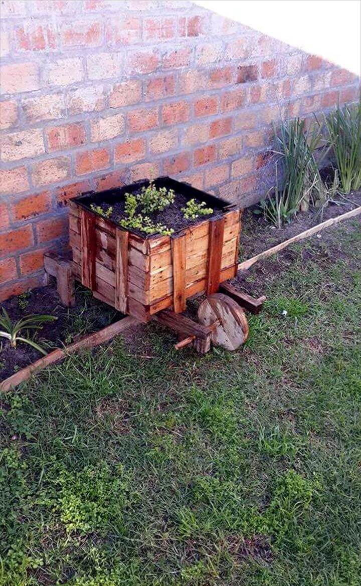 repurposed pallet wheelbarrow planter